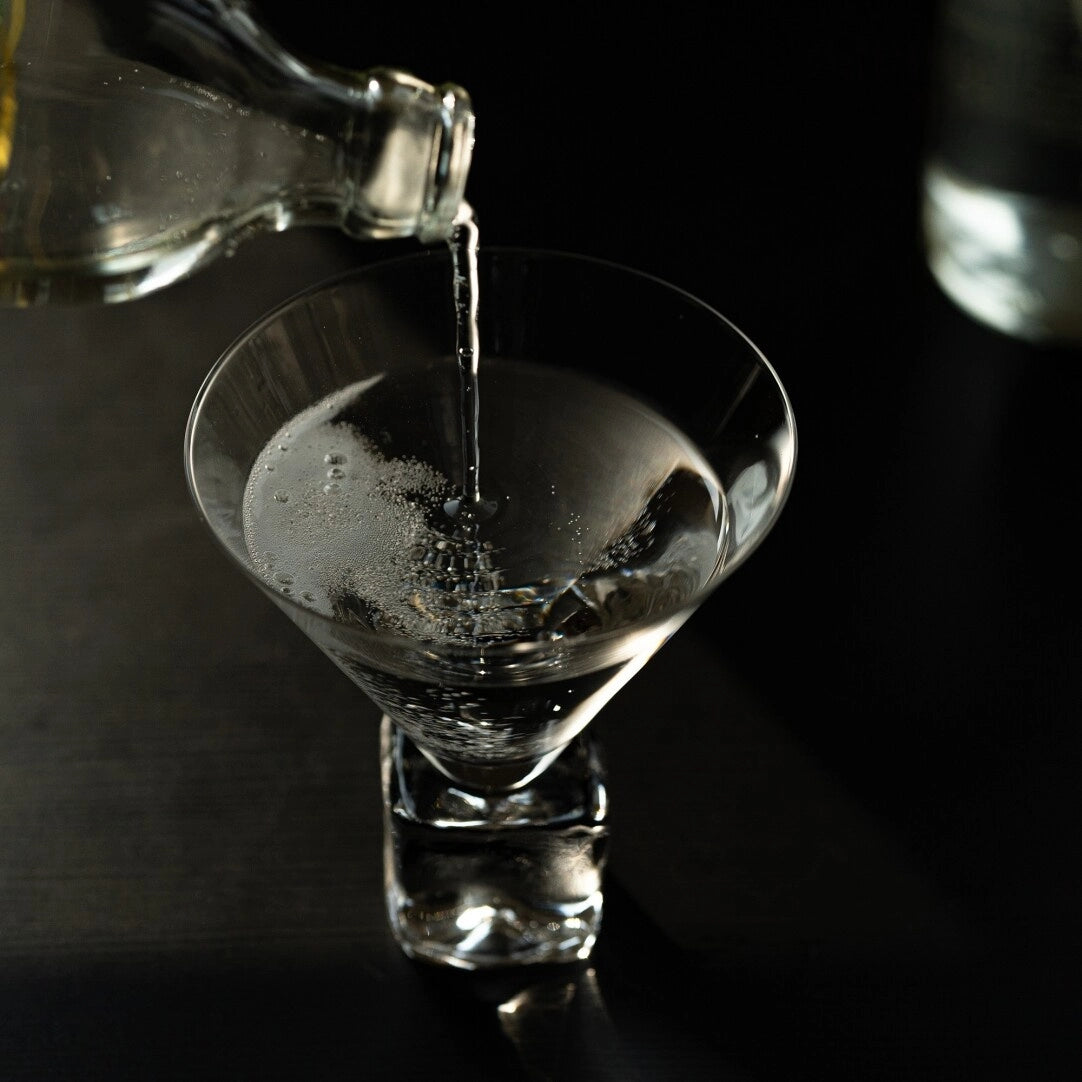 Clear glass wine cup with ice-cube base design, showcasing a modern and elegant style for serving wine.