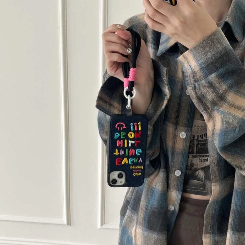 Colorful embroidered letters on a TRLab Shop phone case showing vibrant, decorative embroidery on a sleek protective cover.
