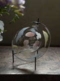 Luminous Fragment Glass Plate by TRLab Shop featuring colorful, glowing glass shards on a sleek surface.