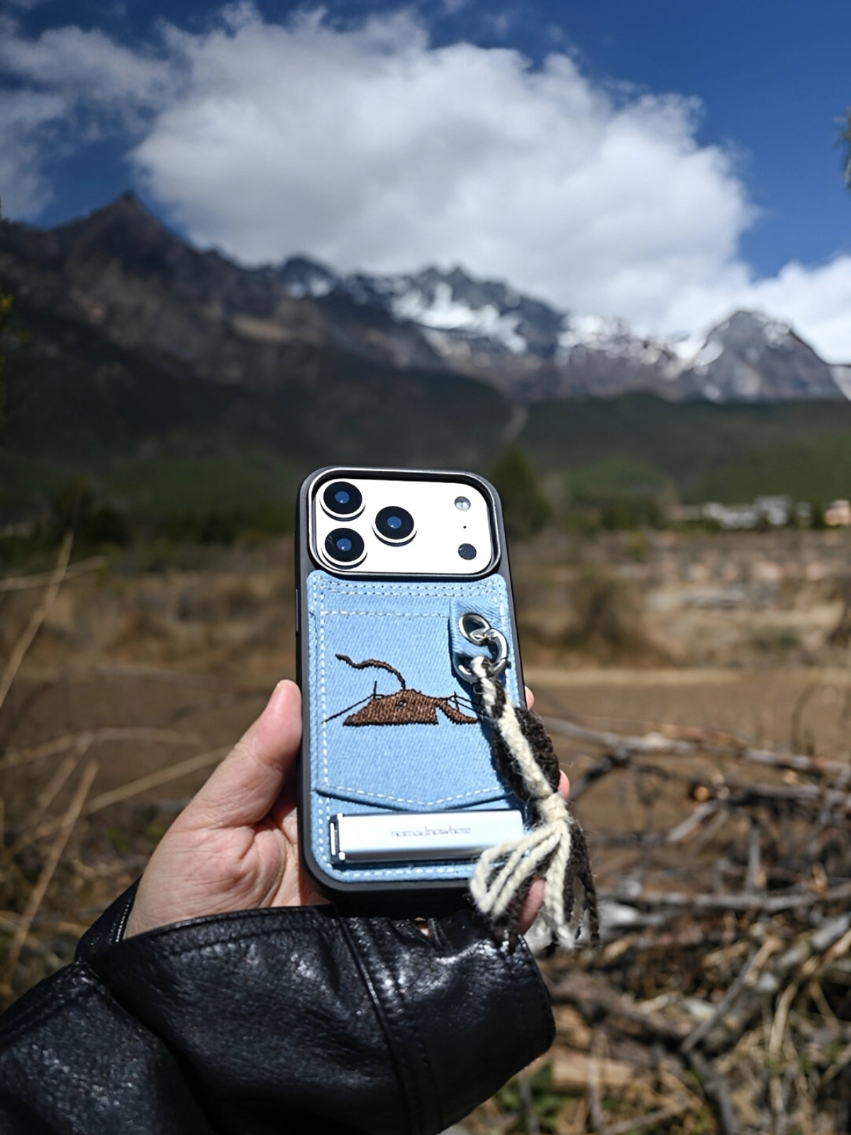 Embroidered tent-shaped phone case with colorful threadwork, designed by TRLab Shop, showing intricate embroidery on durable fabric.