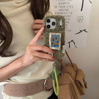 Embroidered tulip phone case by TRLab Shop showing colorful tulip embroidery on a protective phone cover.