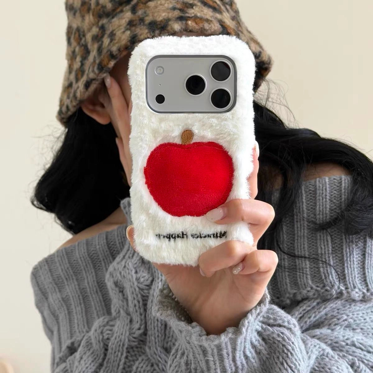 Plush embroidered Apple phone case by TRLab Shop featuring a soft fabric exterior and colorful apple design.