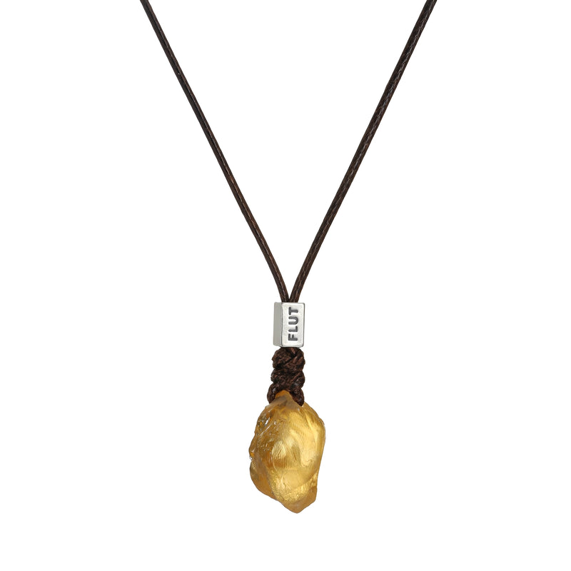 Brazilian Citrine leather cord necklace with a polished citrine pendant, styled with a simple adjustable leather strap.