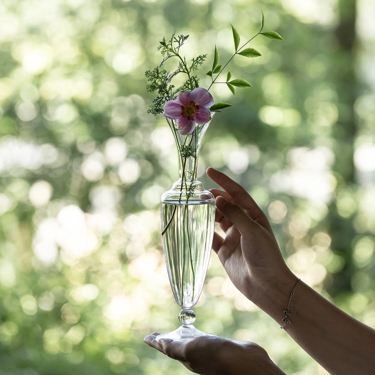 Elegant waisted glass vase by TRLab Shop with a clear, smooth surface and a stylish design suitable for floral arrangements.