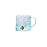 Glacier-textured gradient glass mug by TRLab Shop showing a clear glass mug with icy blue gradient and textured surface.