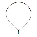 Turquoise hand-woven cord necklace with intricate design, showcasing vibrant color and artisan craftsmanship.