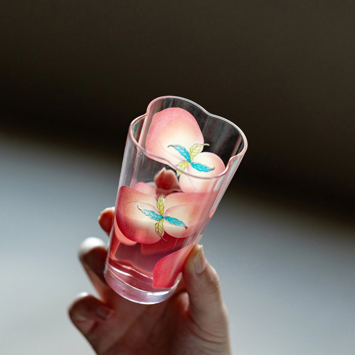 Spring Peach glass tumbler and cold brew bottle by TRLab Shop, with clear peach-colored glass and sleek design.