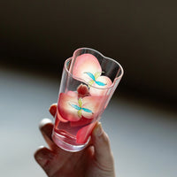Spring Peach glass tumbler and cold brew bottle by TRLab Shop, with clear peach-colored glass and sleek design.