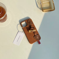 TRLab Shop striped corduroy fabric phone case with toggle button, featuring a stylish design and secure fit.