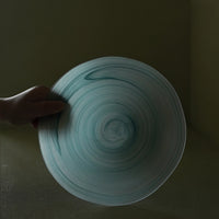 Teal wavy rim glass matte plate with elegant design, perfect for serving or decorative use.