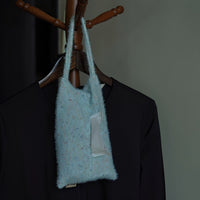 Soft knitted-handle tissue pack from TRLab Shop, featuring a cozy, textured design and compact packaging for easy use.