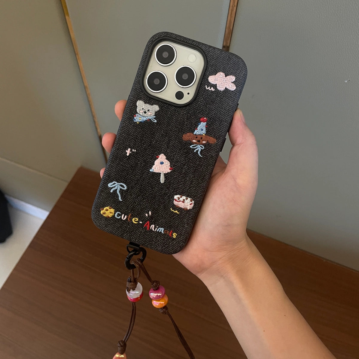 Embroidered animal phone case with colorful animal design on a protective case for a smartphone, by TRLab Shop