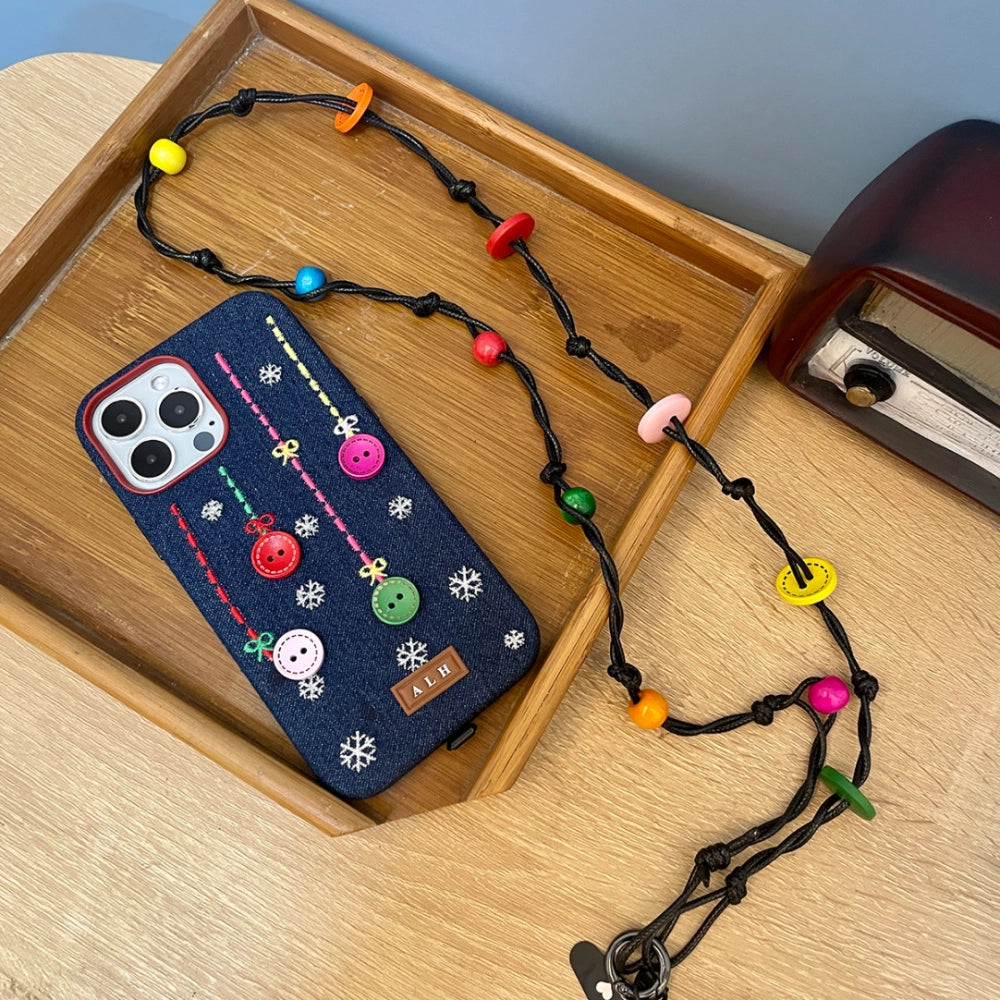 TRLab Shop phone case with embroidered buttons and snowflake design, featuring colorful button details on a protective cover.