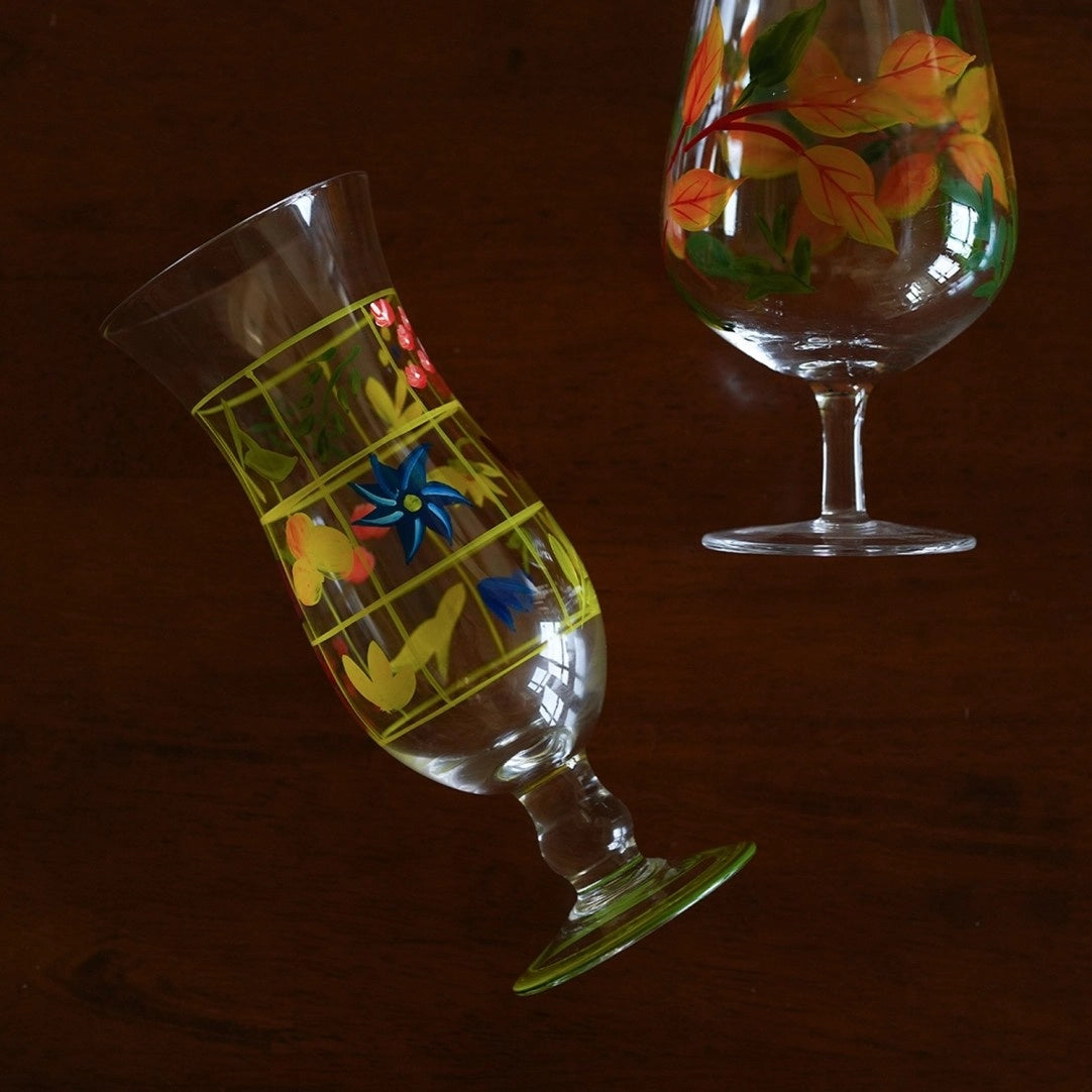 Hand-painted glass vase with intricate floral design, showcasing vibrant colors and artistic craftsmanship.