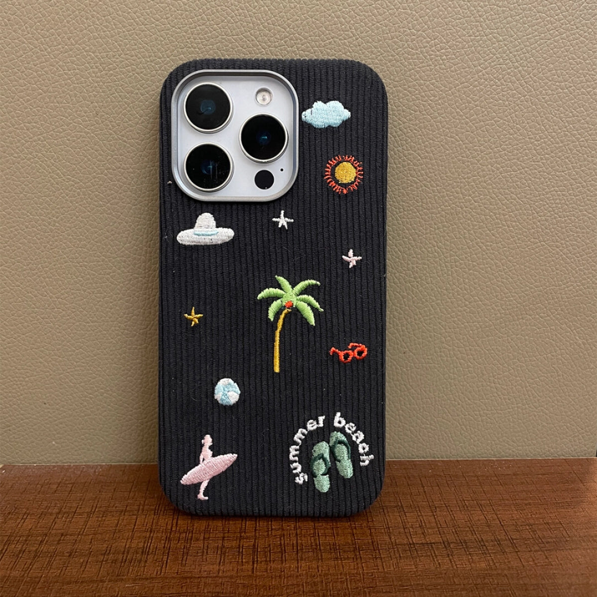 Embroidered TRLab Shop beach phone case with colorful floral embroidery and durable protective design.