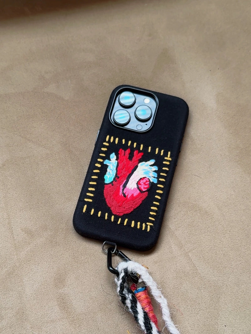 Embroidered heart design phone case by TRLab Shop, featuring colorful stitching on a protective cover for smartphones.