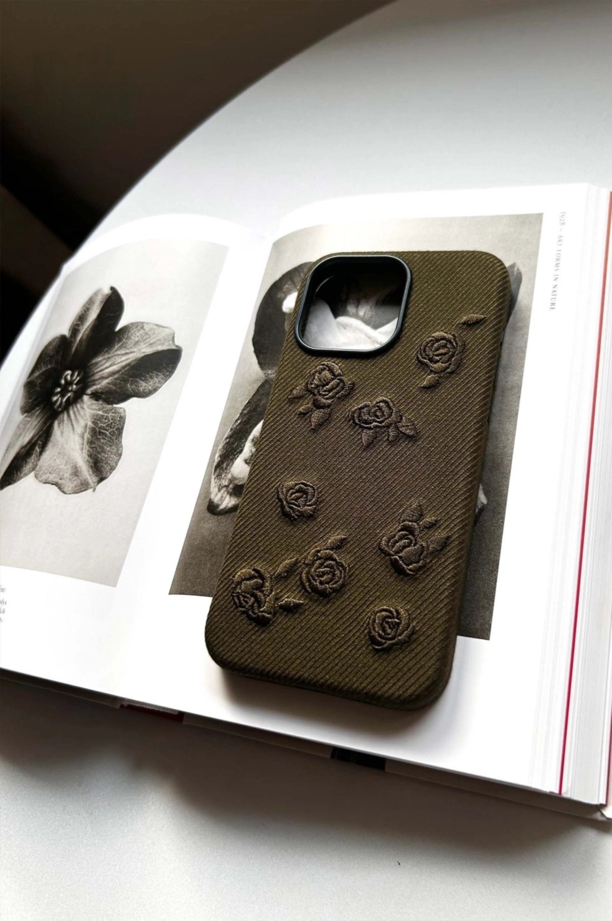 Green phone case with embroidered rose design, compatible with smartphones, by TRLab Shop.