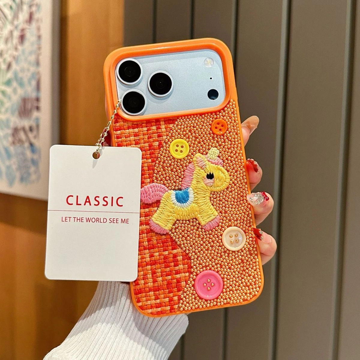 Tweed plaid embroidered unicorn phone case by TRLab Shop, featuring colorful unicorn design and textured fabric.