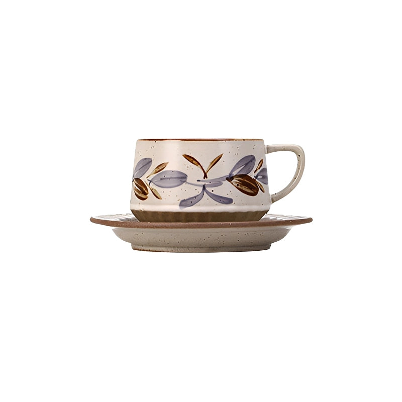 Retro floral ceramic coffee cup and saucer set with colorful floral pattern, perfect for vintage-style tea or coffee servings.