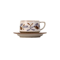 Retro floral ceramic coffee cup and saucer set with colorful floral pattern, perfect for vintage-style tea or coffee servings.