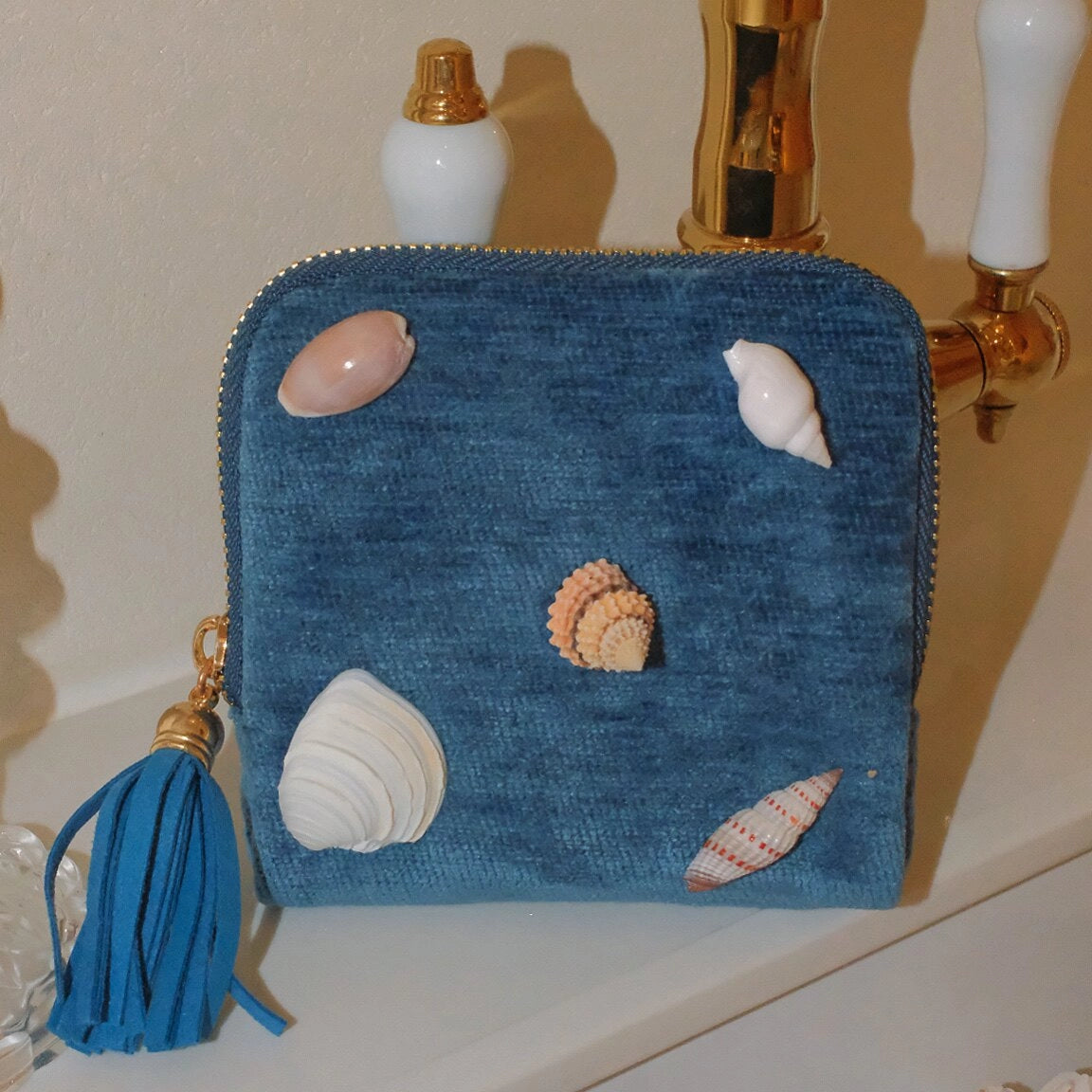 Natural shell velour bag with a soft, textured surface and elegant design, perfect for stylish accessories.