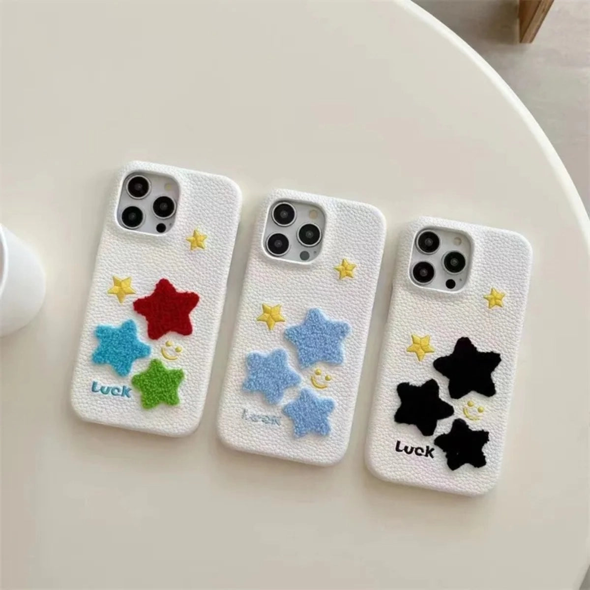 Leather Terry Star embroidered phone case by TRLab Shop, featuring a textured leather surface with star embroidery design.