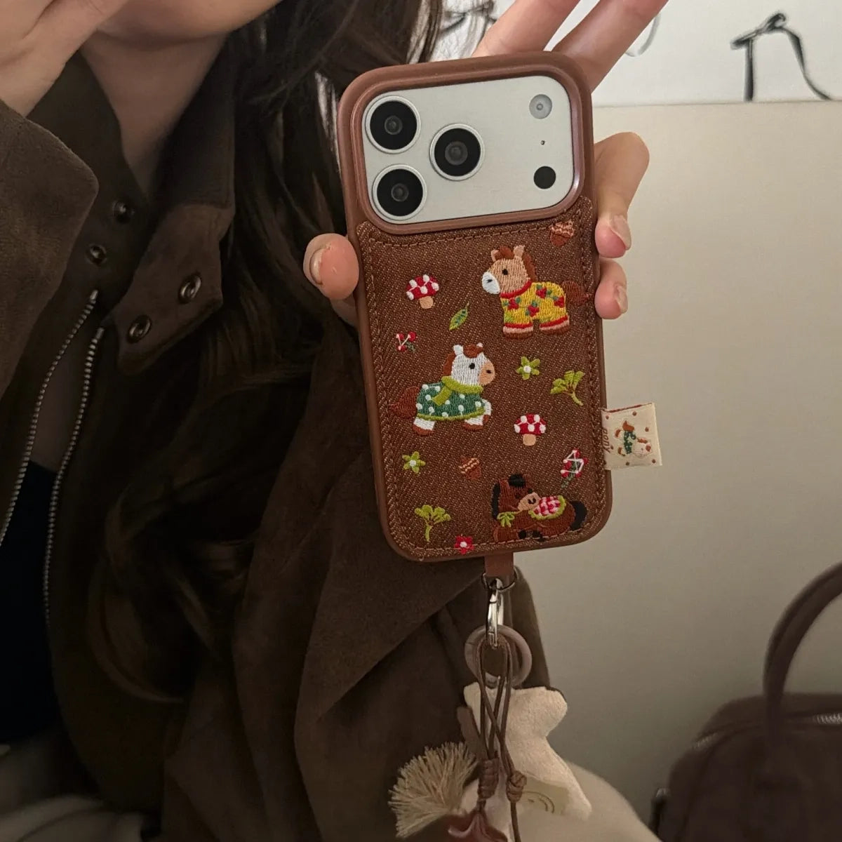 Embroided pony phone case by TRLab Shop featuring colorful pony embroidery on durable protective cover.