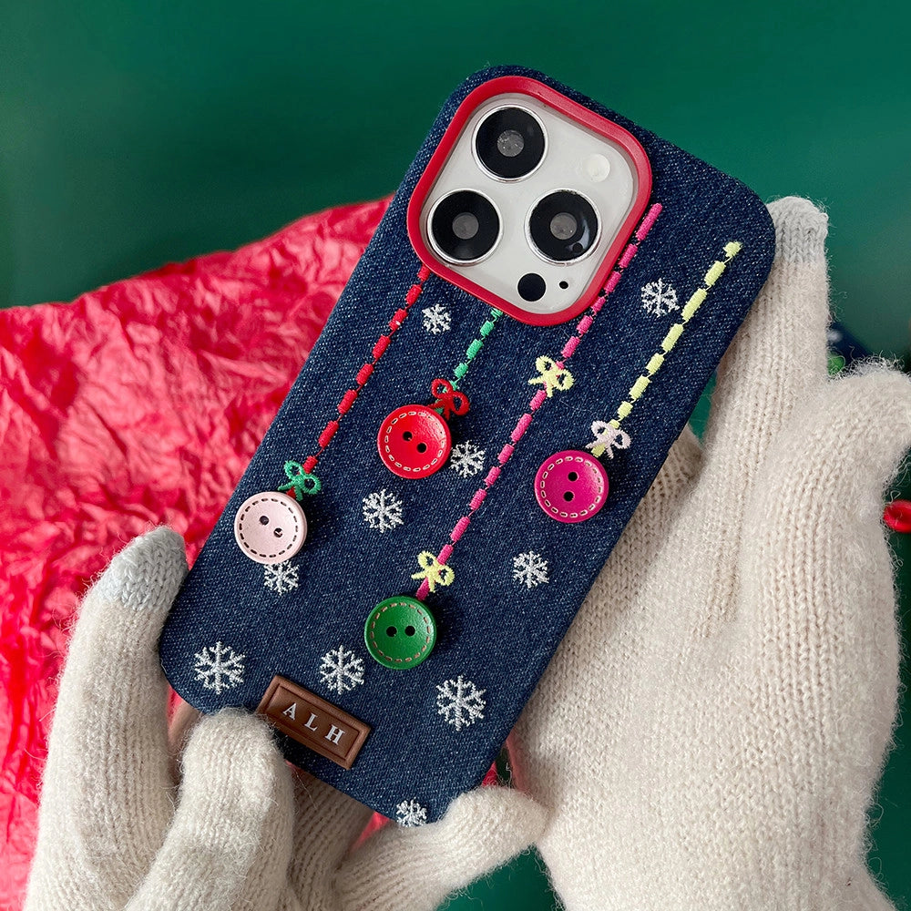 TRLab Shop phone case with embroidered buttons and snowflake design, showcasing detailed embroidery on a protective case.