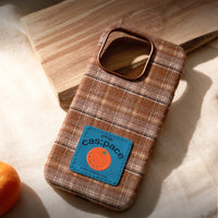 Brown plaid fabric phone case by TRLab Shop with a soft, stylish design perfect for protecting and accessorizing smartphones.