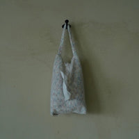 Knitted-handle tissue pack by TRLab Shop with soft, textured fabric and six tissue compartments in a compact design.