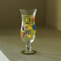 Hand-painted glass vase with vibrant floral design, showcasing intricate artwork and a sleek, transparent glass body.