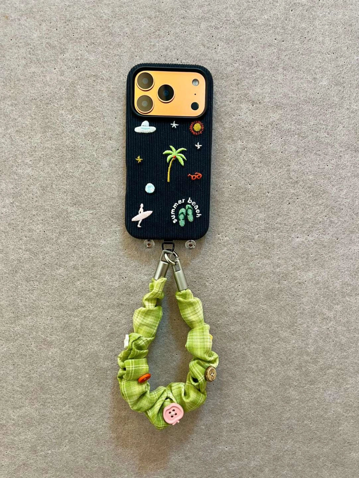 Embroidered beach phone case by TRLab Shop featuring colorful floral embroidery on durable material, designed for outdoor use.