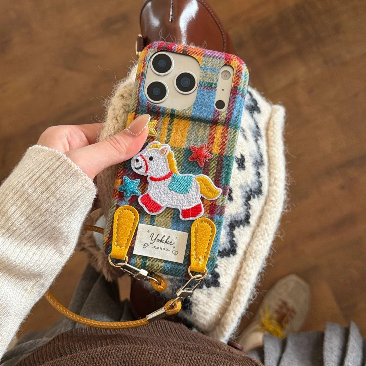 Plaid Pony embroidered phone case by TRLab Shop featuring a colorful plaid pattern and a cute pony embroidery design.