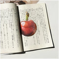 Translucent fruit-shaped acrylic bookmark with colorful fruit illustrations, ideal for marking pages in books.