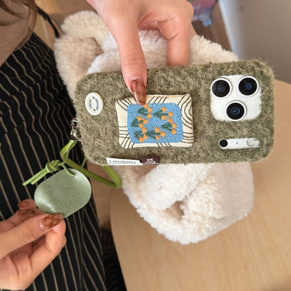 Embroidered tulip design phone case by TRLab Shop, showcasing colorful floral embroidery on a protective smartphone cover.