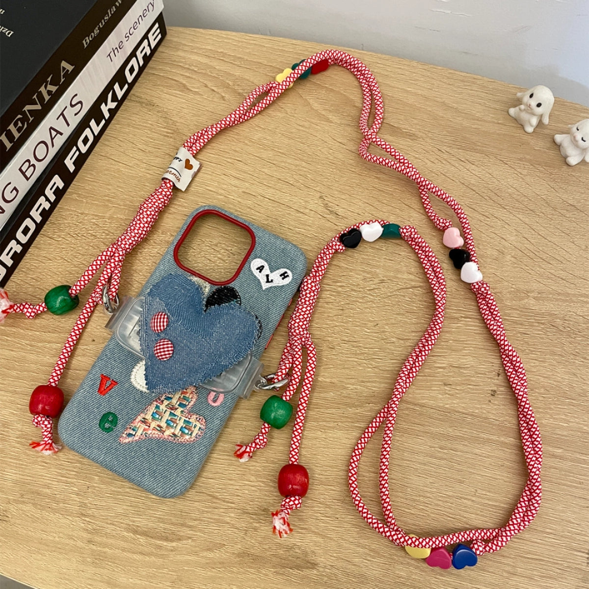 Love Heart embroidered phone case with colorful heart designs, made by TRLab Shop, shown on a smartphone in the image.