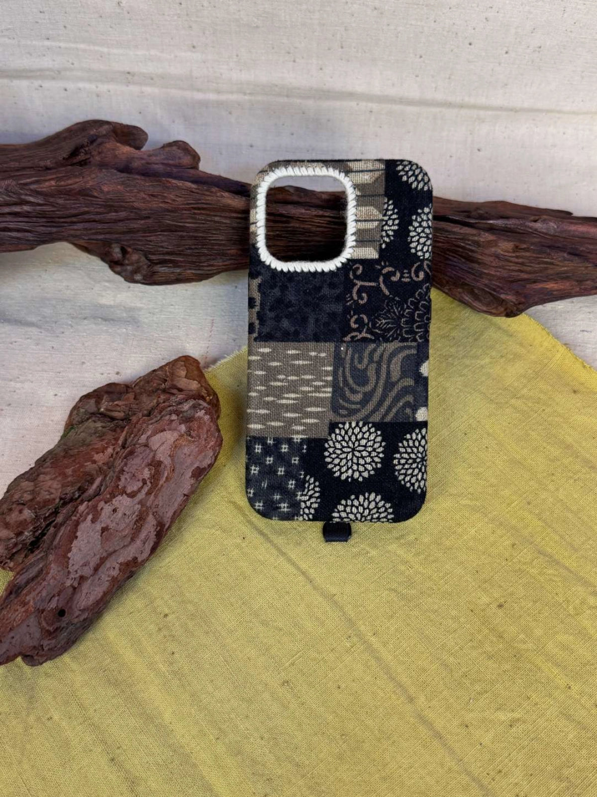 Colorful tie-dyed fabric phone case by TRLab Shop with a vibrant, swirling pattern and soft texture for smartphone protection.