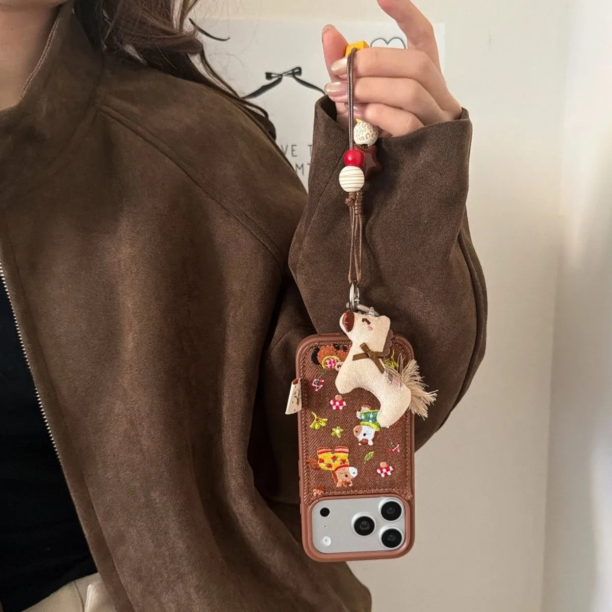 Embossed pony embroidered phone case with colorful stitching, compatible with smartphones, by TRLab Shop.