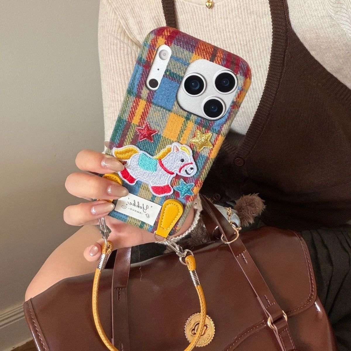 Plaid Pony embroidered phone case by TRLab Shop featuring a colorful plaid pattern and a cute pony embroidery design.