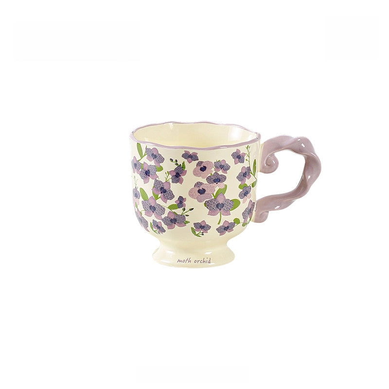 Ceramic mug with floral pattern and twisted handle by TRLab Shop, featuring colorful floral design on white ceramic background.