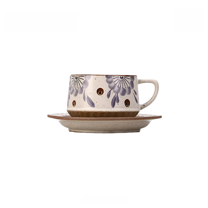 Retro floral ceramic coffee cup with matching saucer from TRLab Shop, featuring a colorful vintage floral pattern.