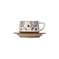 Retro floral ceramic coffee cup with matching saucer from TRLab Shop, featuring a colorful vintage floral pattern.