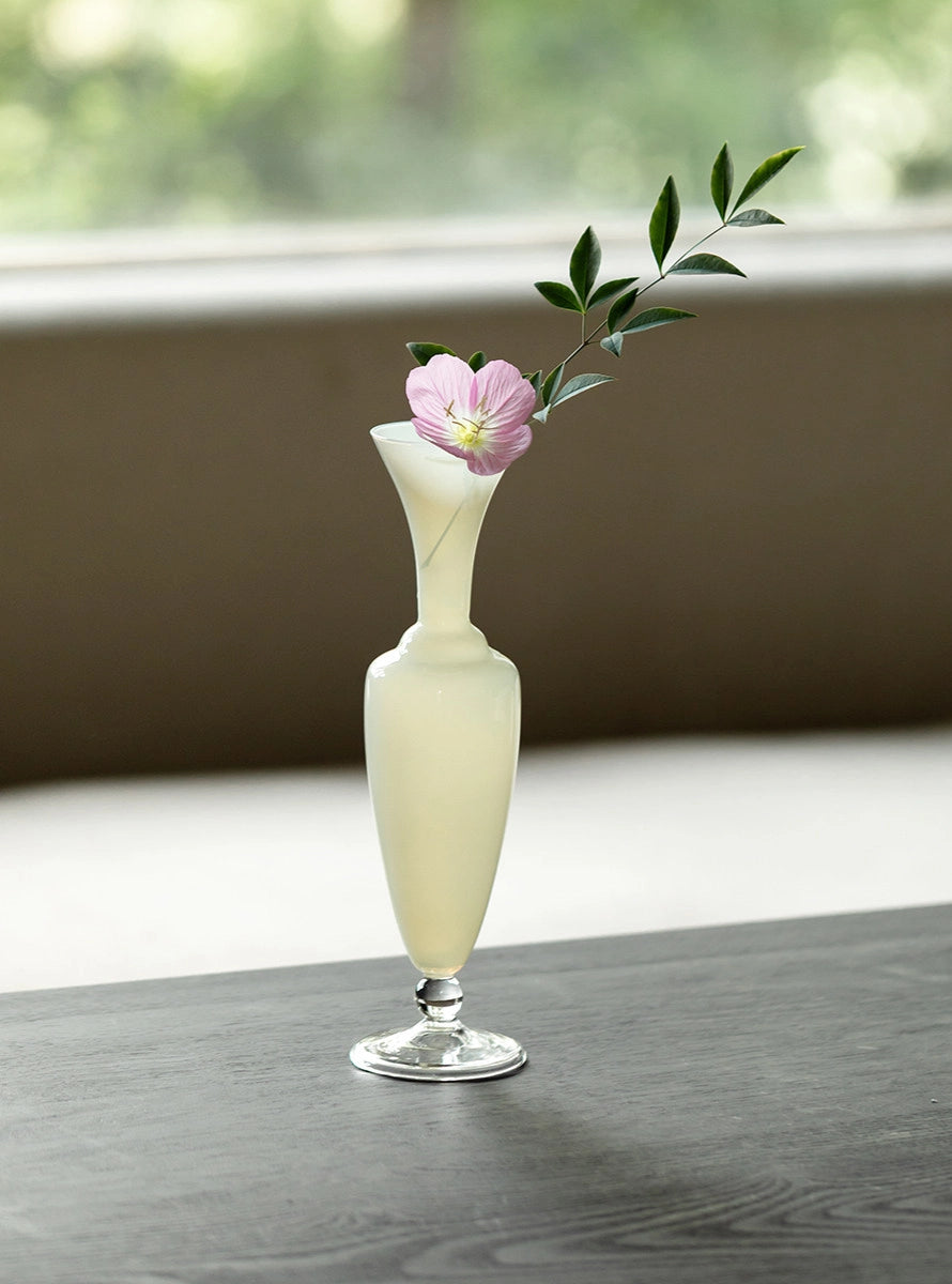 Elegant waisted glass vase by TRLab Shop with a clear, smooth surface and a stylish shape suitable for floral arrangements.