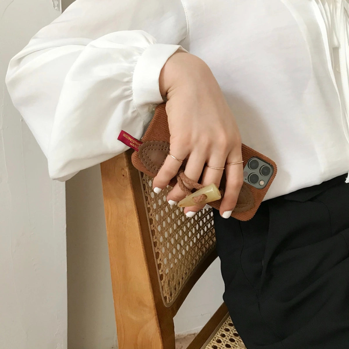 Striped corduroy fabric phone case with toggle button closure, designed by TRLab Shop for a stylish and protective fit.