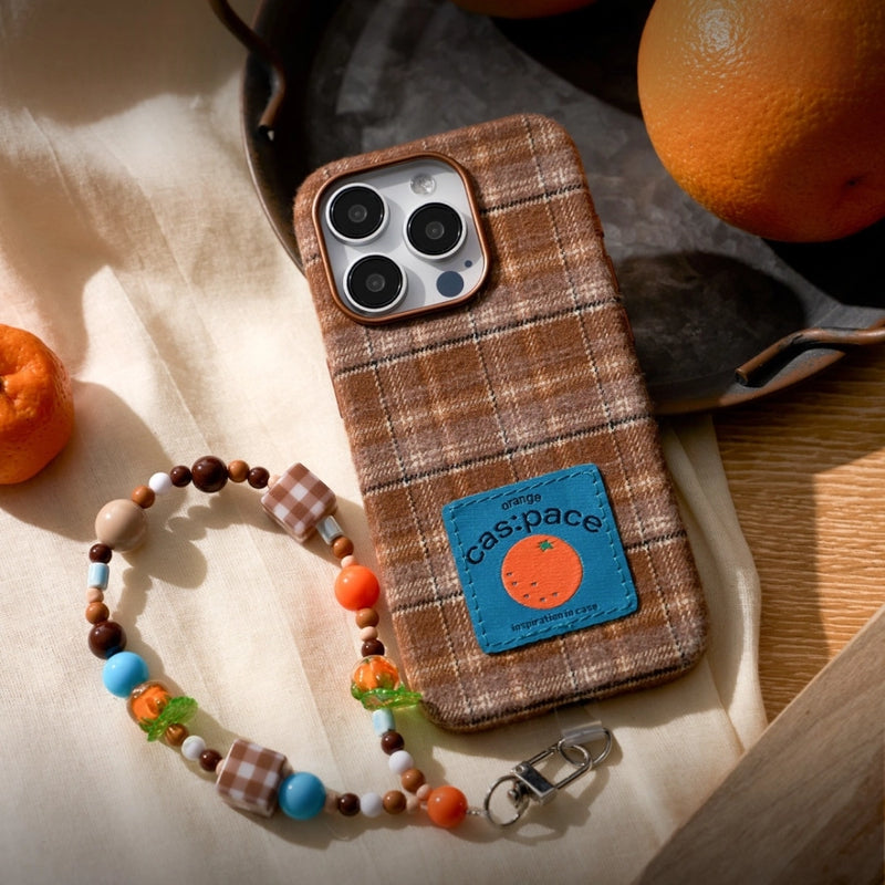 Brown plaid fabric phone case with TRLab Shop branding, featuring a soft textile exterior and precise cutouts for phone access.