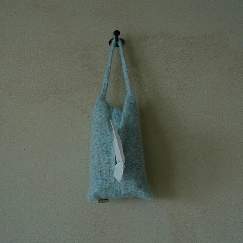 Knitted-handle tissue pack from TRLab Shop, soft tissue paper with stylish knitted fabric handle for easy carrying.