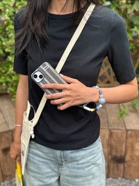 Striped fabric phone case in blue and white with TRLab Shop branding, designed for a secure fit and stylish protection.