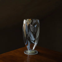 Luminous Fragment Glass Vase by TRLab Shop with textured, glowing glass surface, perfect for decorative floral arrangements.