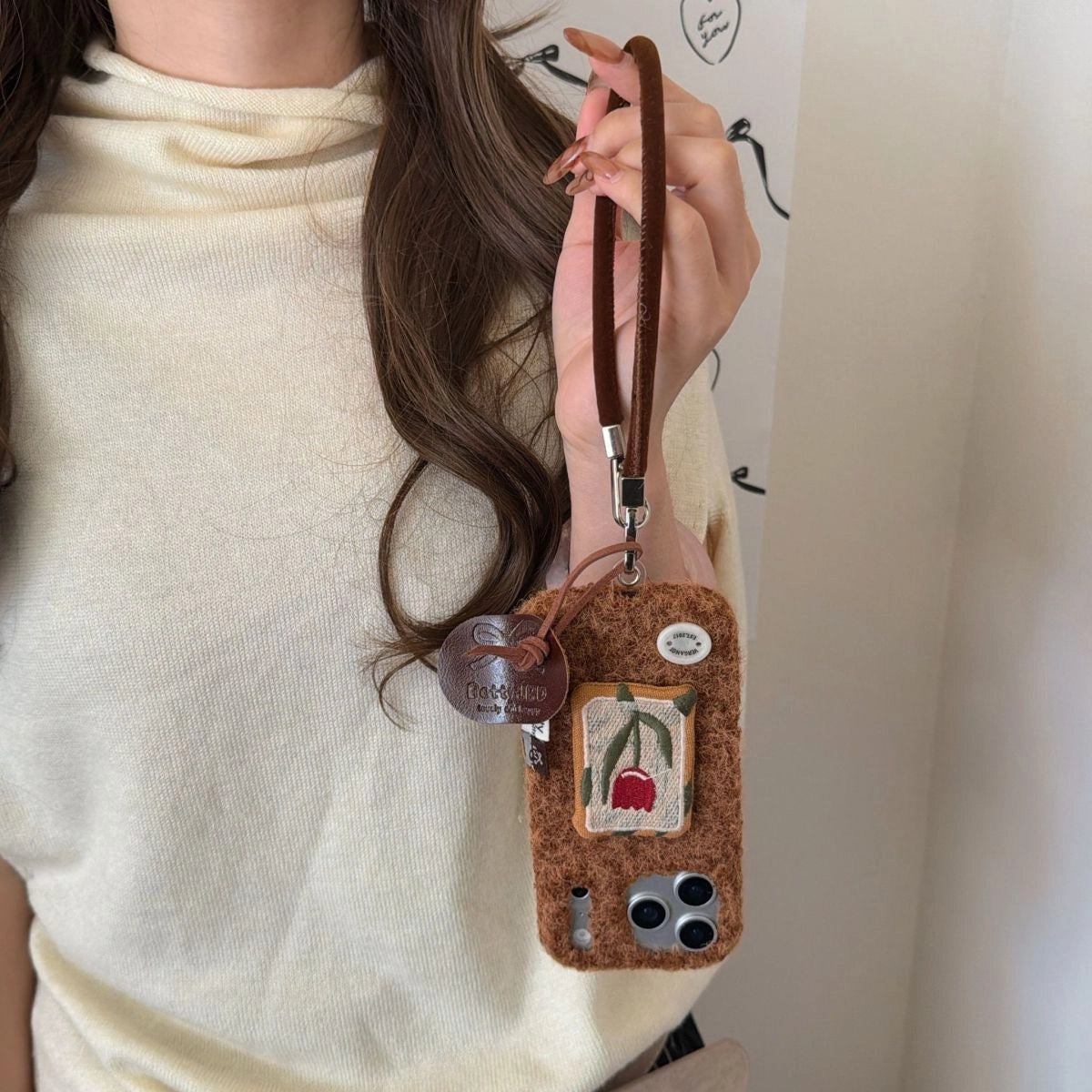 Embroidery tulip design on a TRLab Shop phone case with detailed floral embroidery on a protective phone cover.