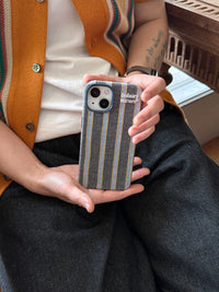 Striped fabric phone case by TRLab Shop with colorful horizontal stripes, soft texture, and snug fit for smartphones.